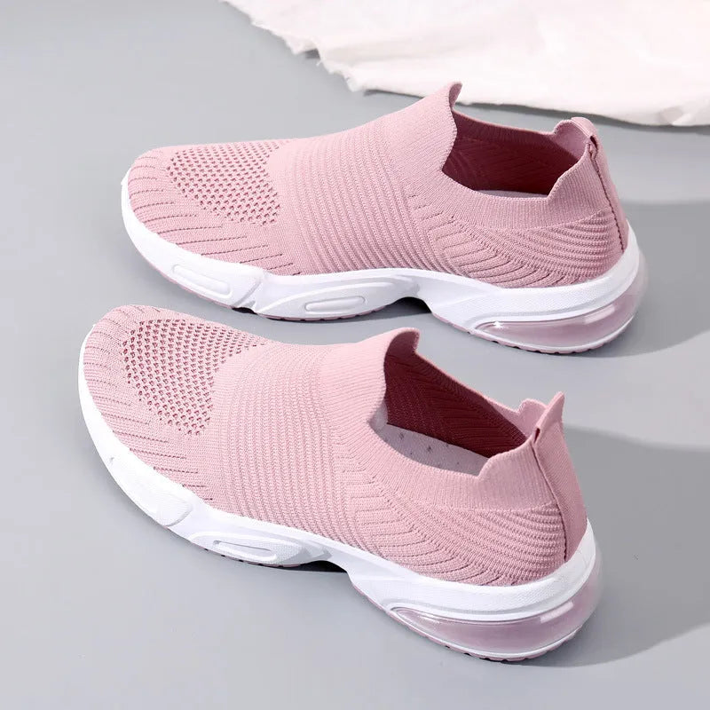 Slip-on sock shoes with mesh lining and lightweight PVC sole in black, white, khaki and pink colours