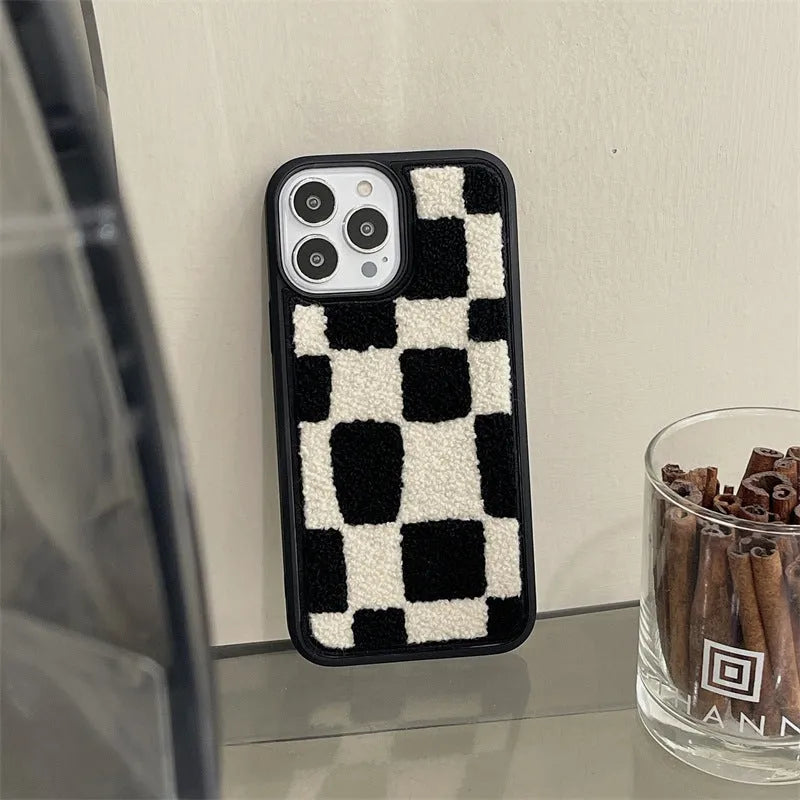 Black and white lattice silicone back cover for Apple iPhone, protective case on a white background
