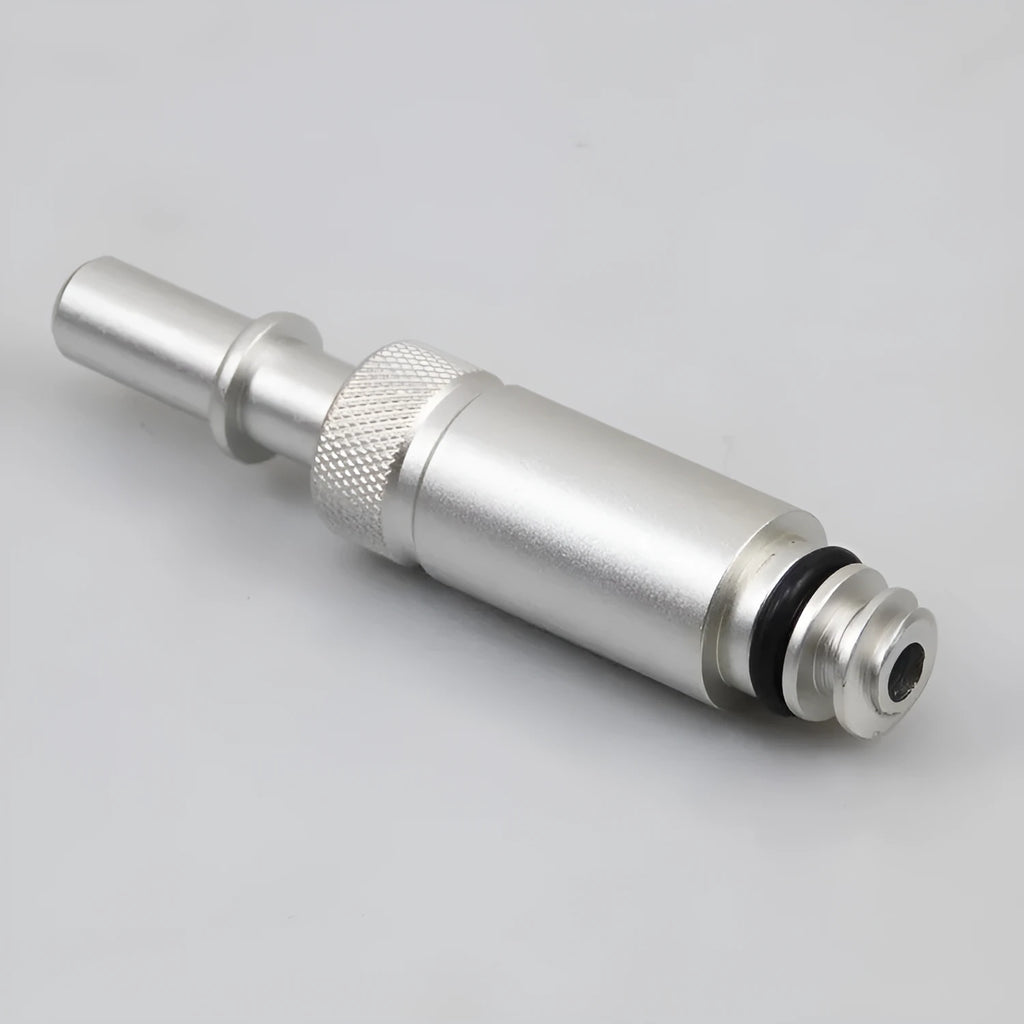 Silver metal transmission refuelling joint tool for VAS6262-9 on a workshop bench.