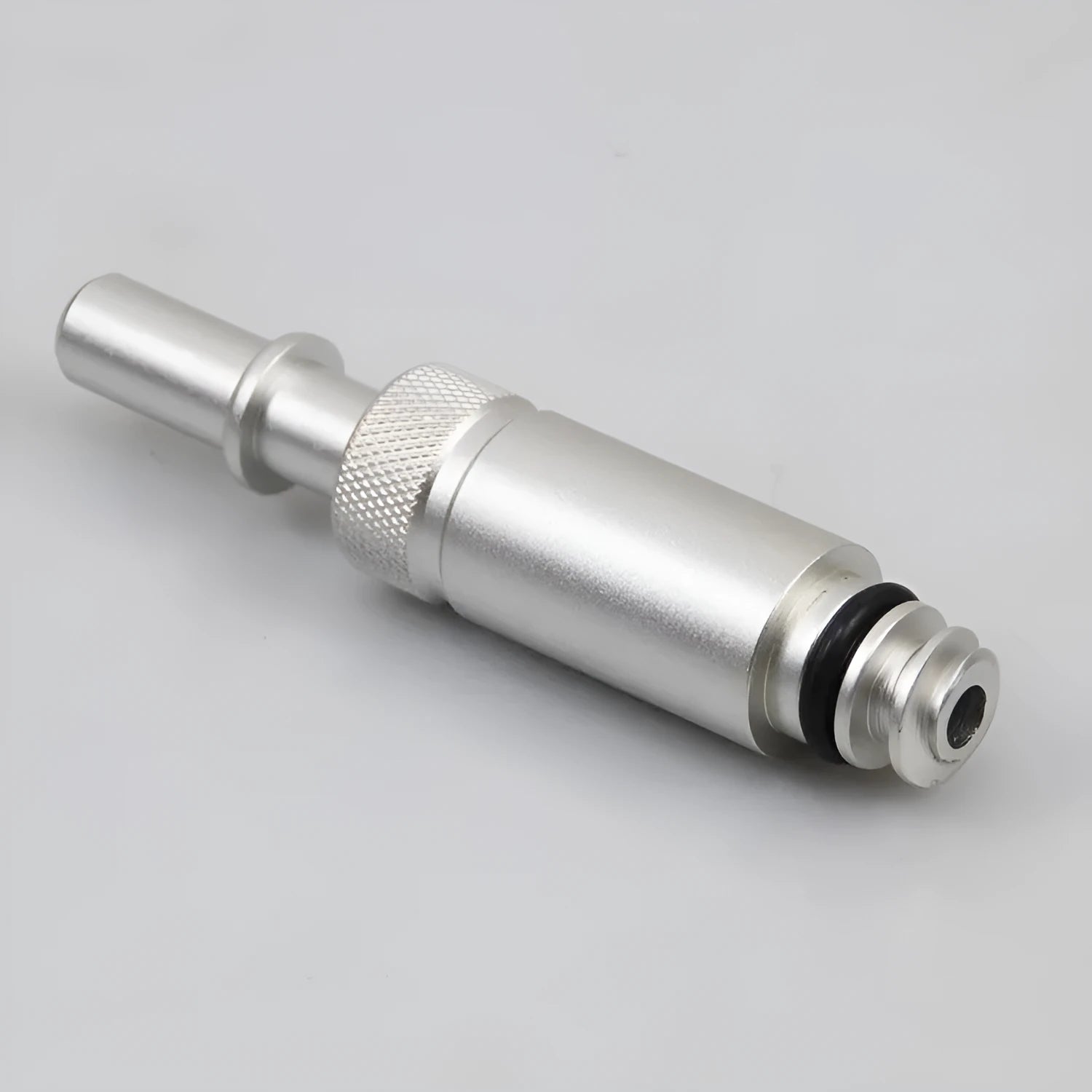 Silver metal transmission refuelling joint tool for VAS6262-9 on a workshop bench.