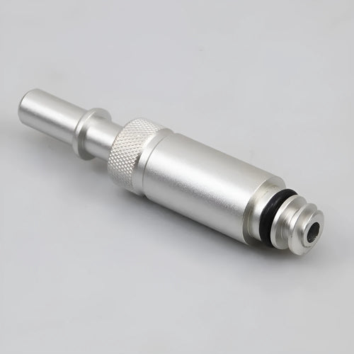 Silver metal transmission refuelling joint tool for VAS6262-9 on a workshop bench.