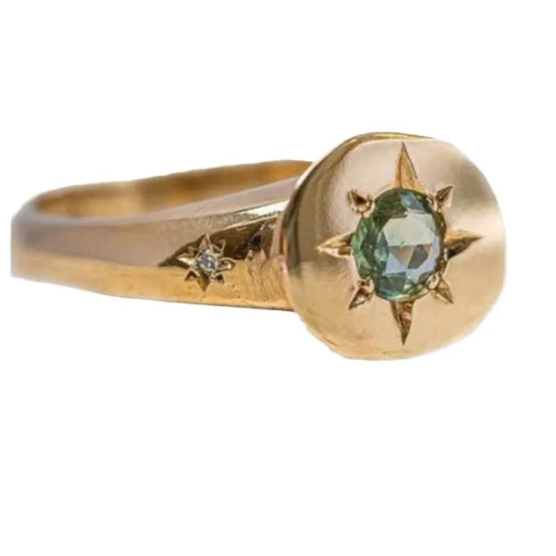 Golden adjustable ring with oval star shape and zircon micro inlay detail.