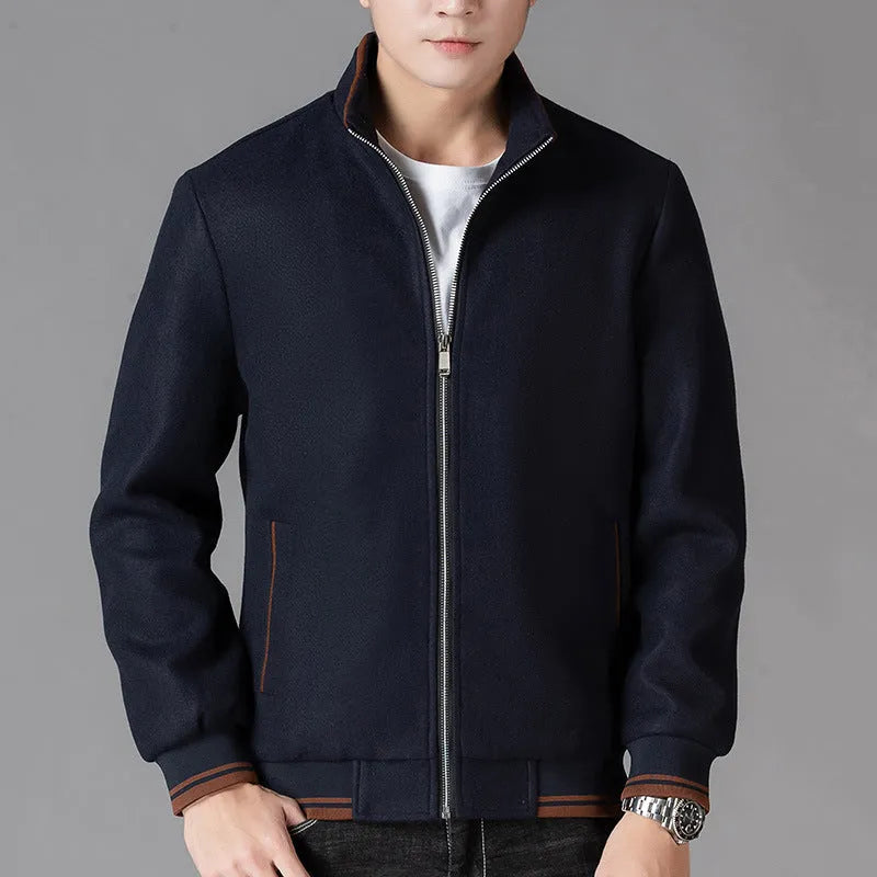 Men's grey polyester fleece jacket with zip front, long sleeves, and a chest pocket, shown on a hanger.