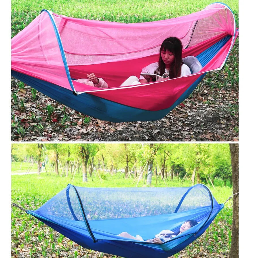 Double hammock bed 260x150cm in Army Green with mosquito-blocking mesh on a camping site