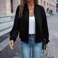 A black women's long sleeve zip-up casual jacket with faux pockets.