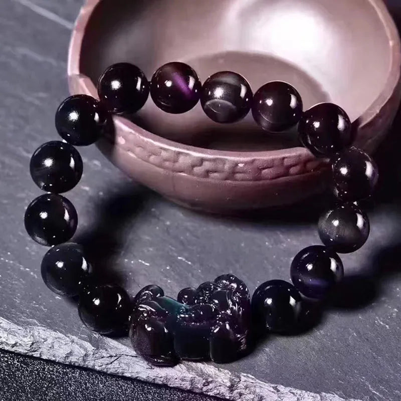 Natural ice colour eye obsidian crystal bracelet with polished round beads on wrist