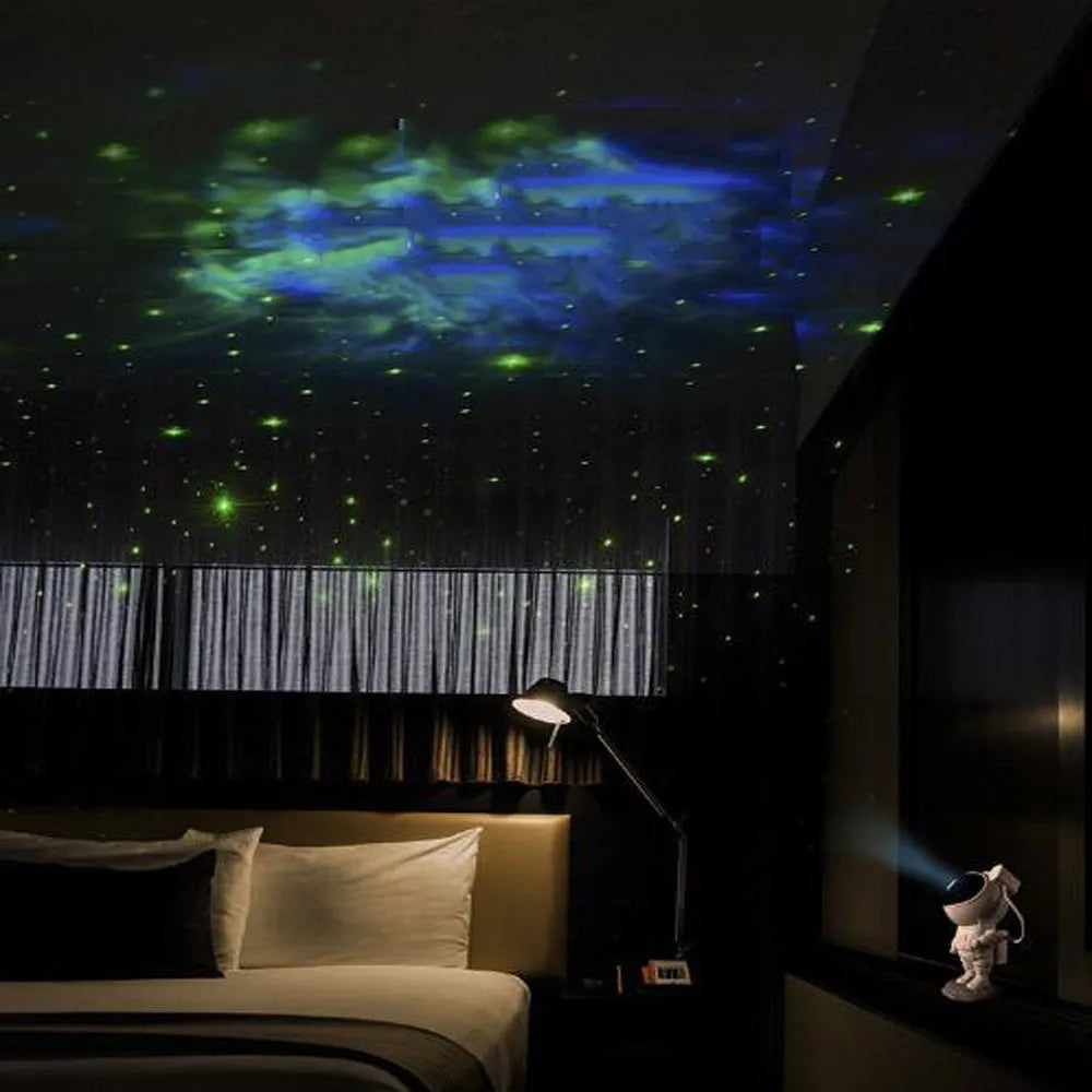 Creative astronaut galaxy starry sky projector nightlight on a table with nebula and star effects displayed against a dark background