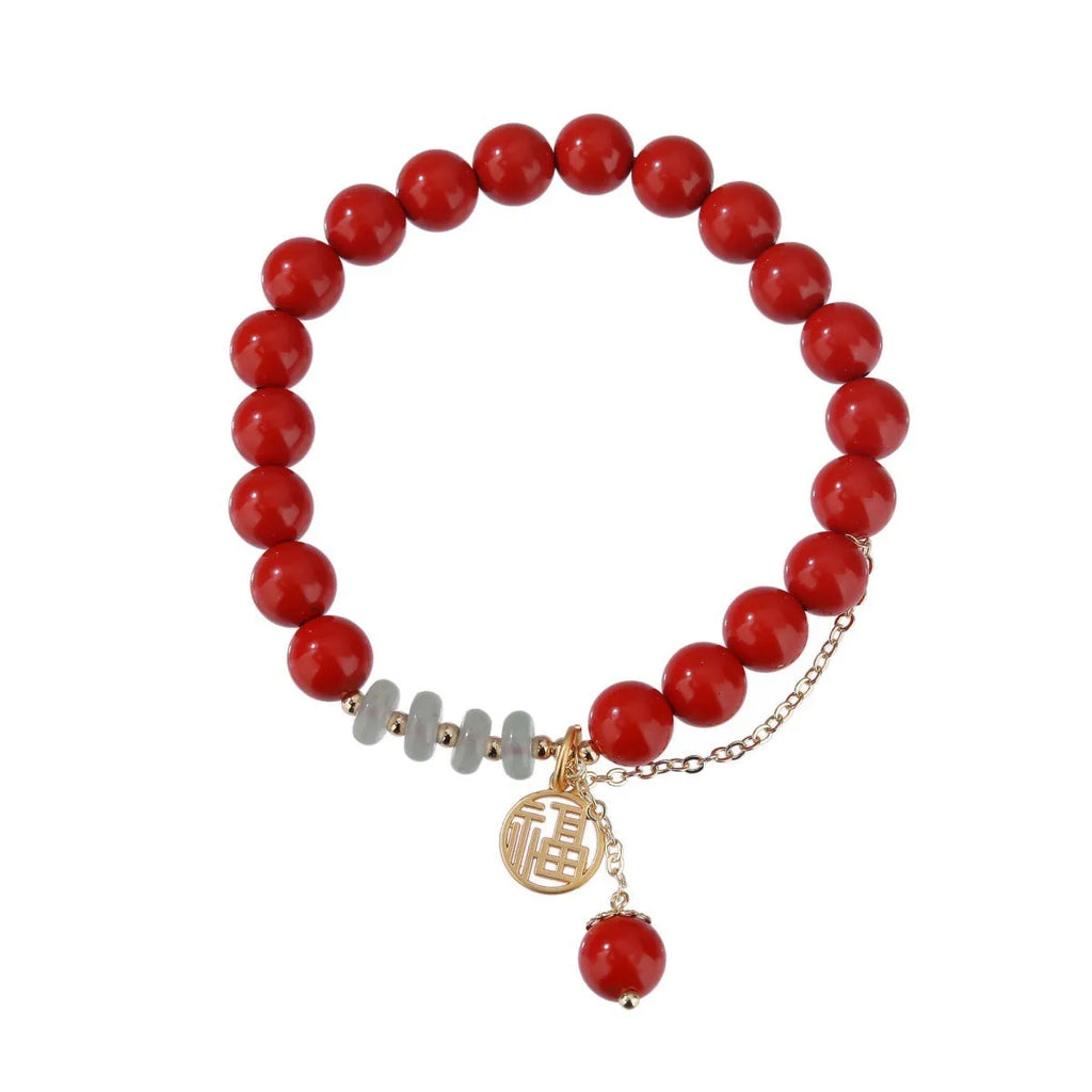 Retro red cinnabar bracelet with carved fu character, jade bead, and leather tassel cord