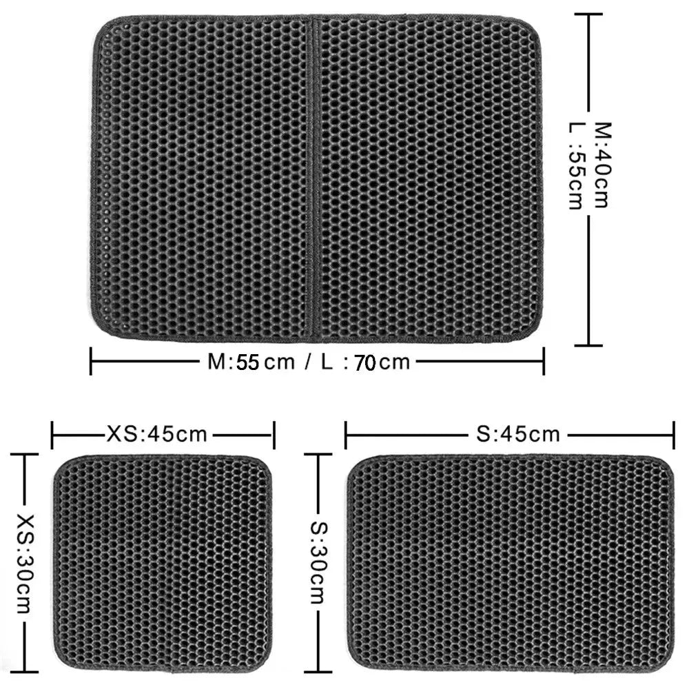 Black waterproof EVA cat litter mat with honeycomb texture and quilted edge on a wooden floor
