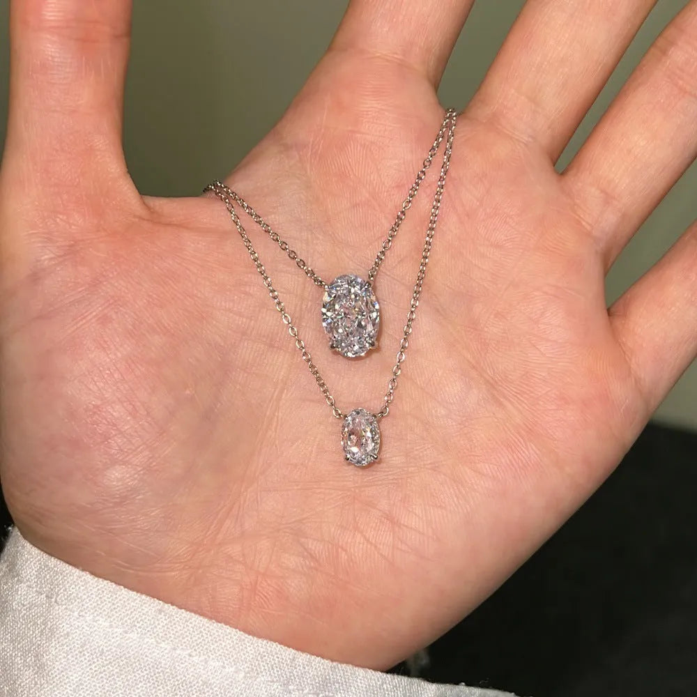 Sterling silver necklace with geometric oval ice flower pendant in platinum or gold finish