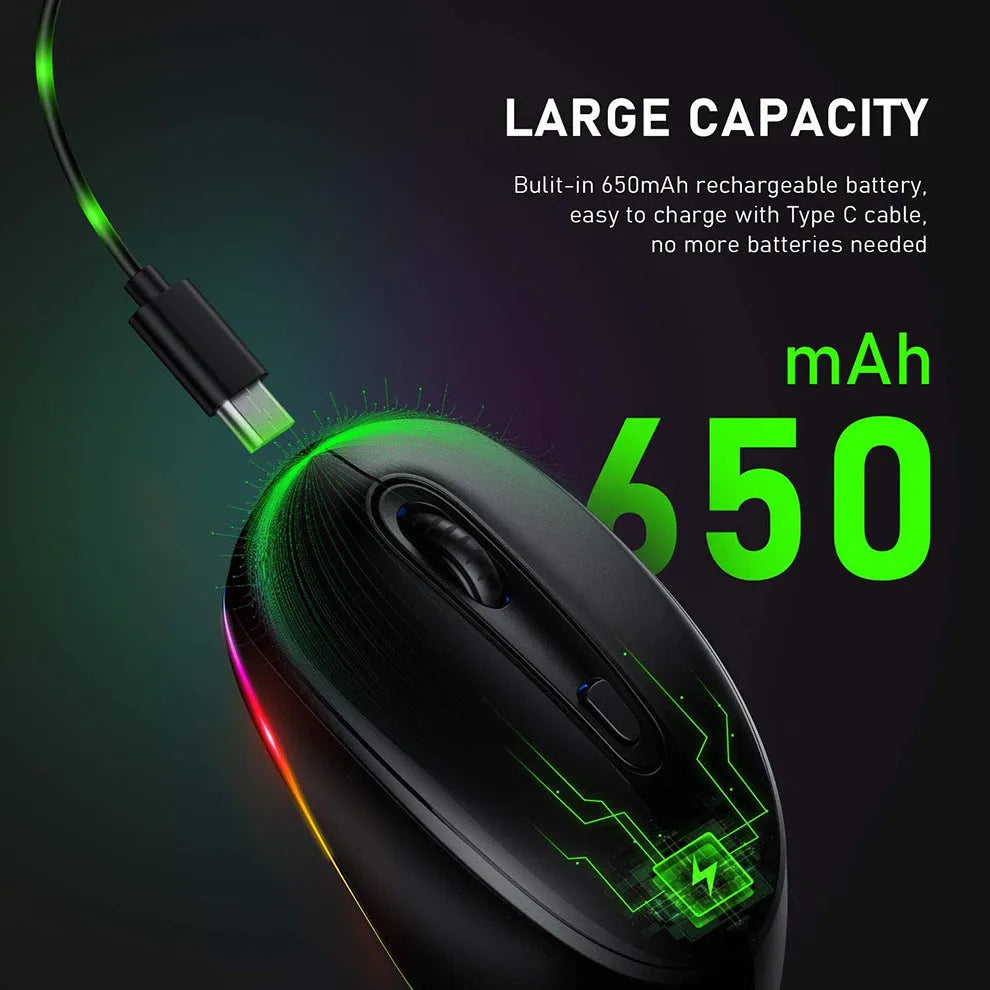 Compact white wireless mouse with ergonomic shape on a desk next to a laptop