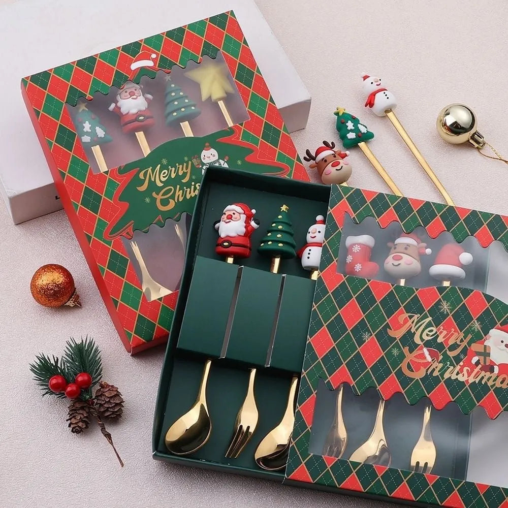 Red stainless steel Christmas spoon and fork set with snowman and Christmas tree designs on the handles.
