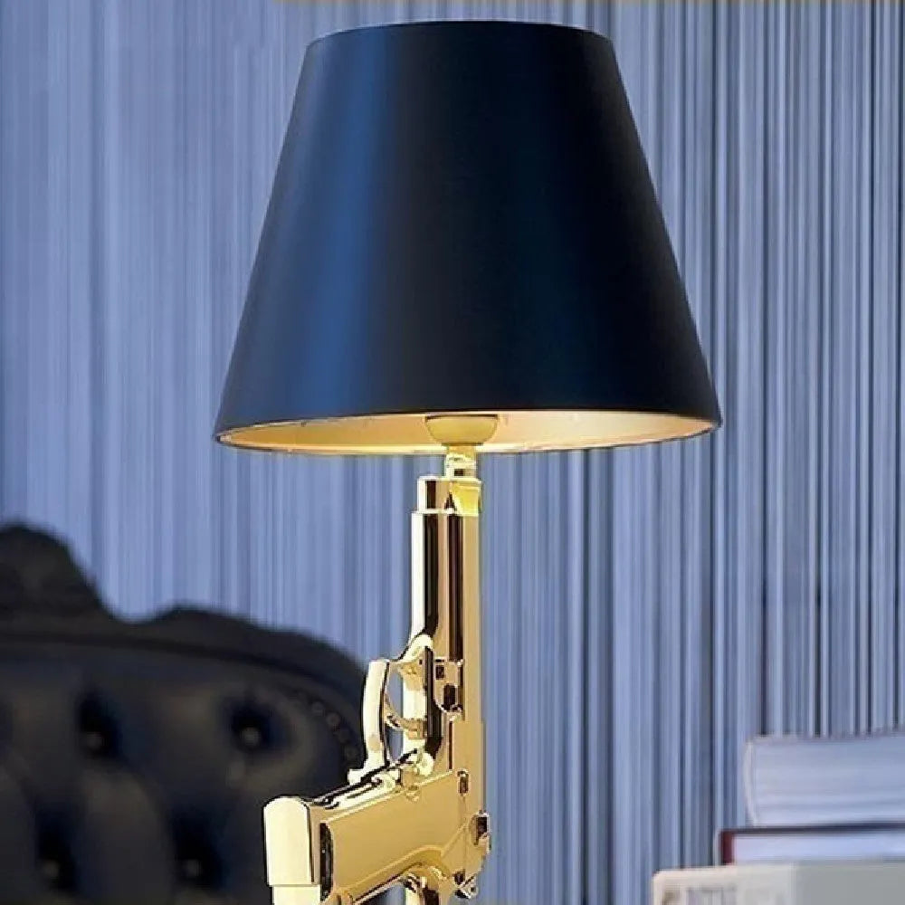 Nordic style creative desk lamp with plated gold resin base on a wooden desk