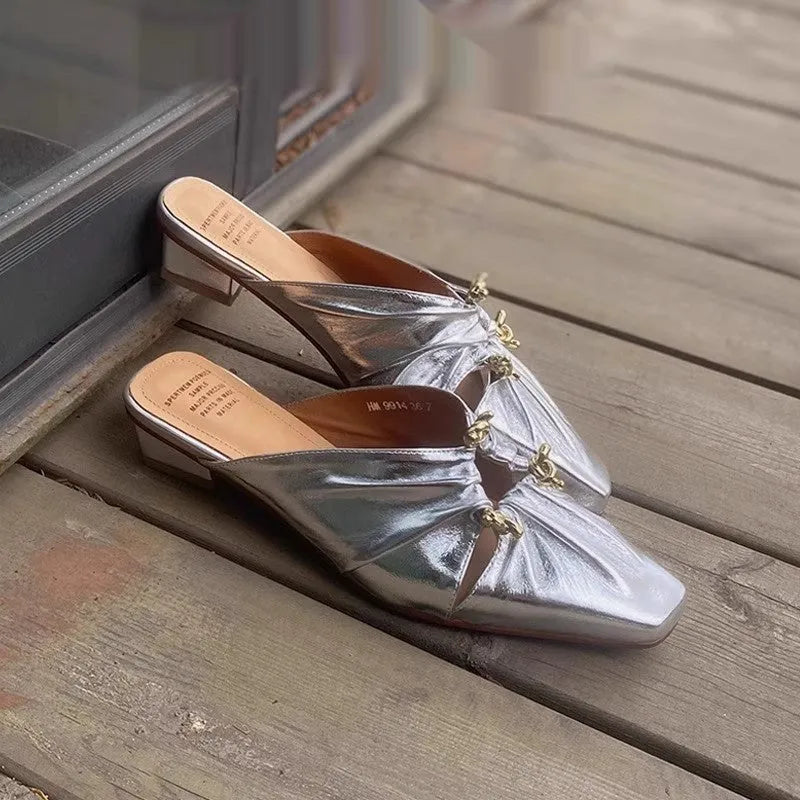 Genuine leather women's square toe slippers in beige, low heel, shown from side.