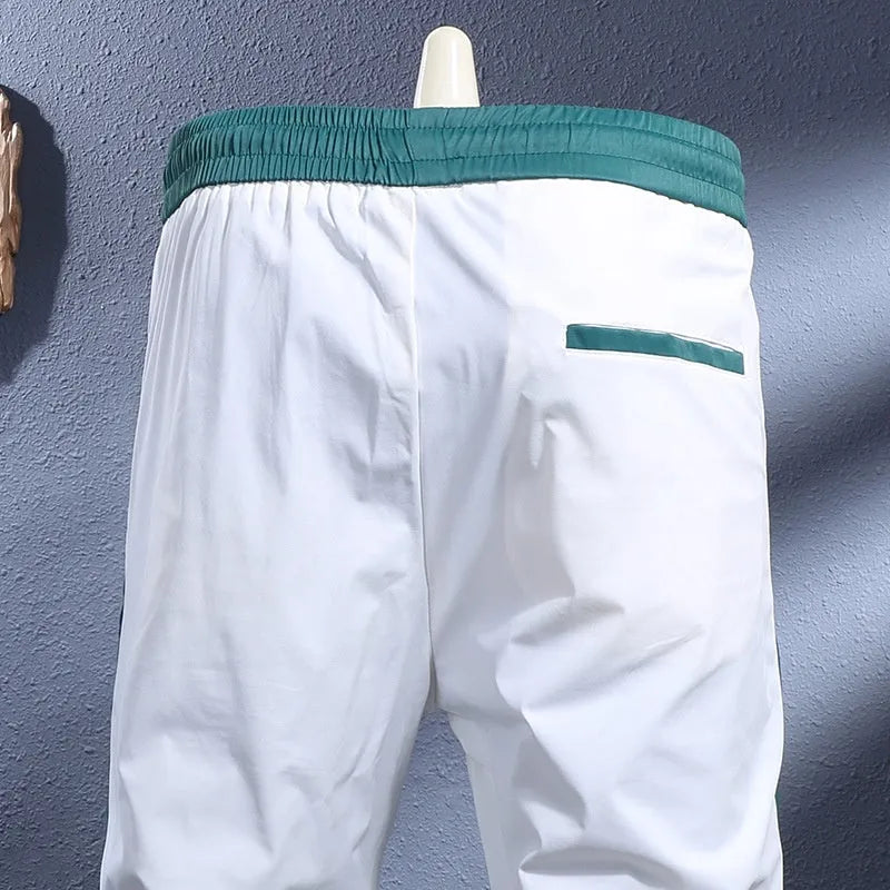Ice silk breathable stretch ankle-tied skinny sports trousers for men in black striped pattern