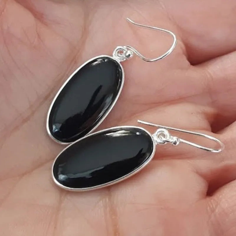 Women's black oval agate pendant earrings with 925 silver detail and geometric Chinese design