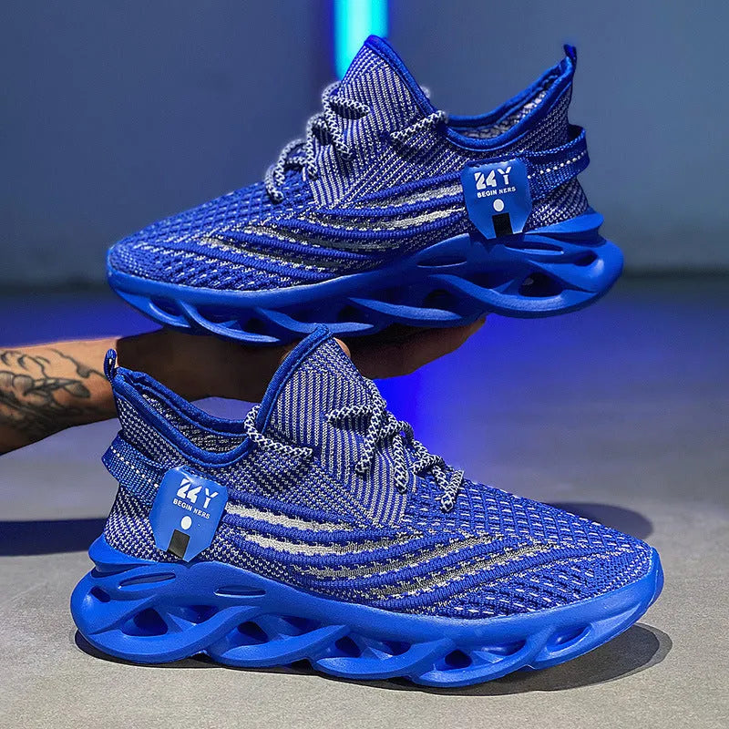 Men's blue Flyknit sneakers with mesh upper, foam platform sole, and round toe on a light background.