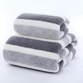 Coral fleece towel with wide stripe dark light pattern in multiple colours