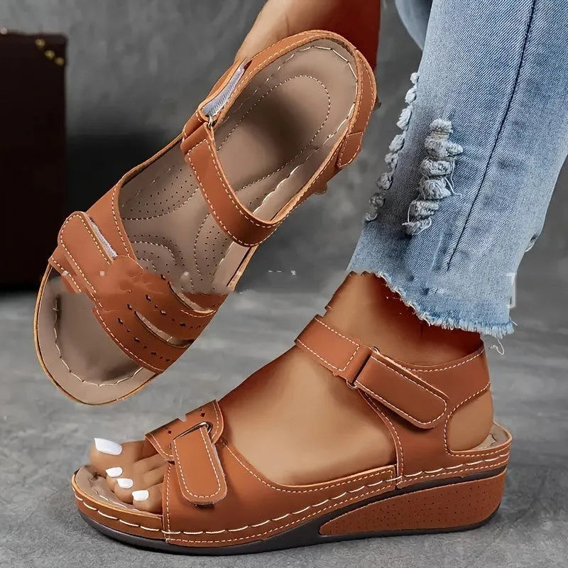 Women's beige plus size sandals with a thick composite sole and an adjustable Velcro strap fastener.