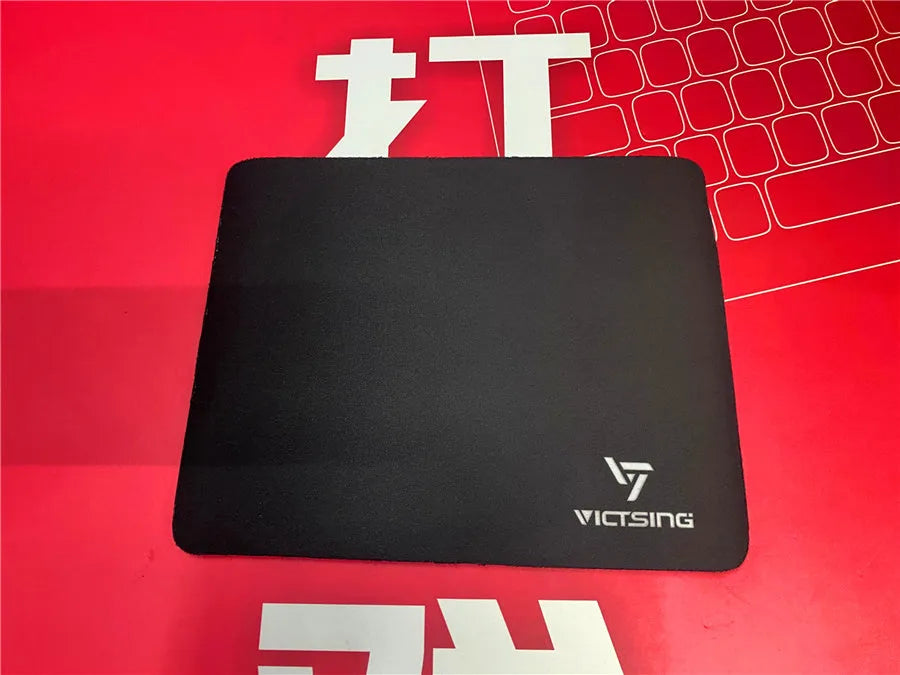 Black thickened rubber gaming mouse pad with rough grain texture, shown with a mouse on its 270mm x 220mm surface.