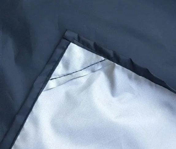 Magnetic car snow shield in black or silver, shown covering a car windscreen, available in 215x150x125cm and 245x180x145cm.