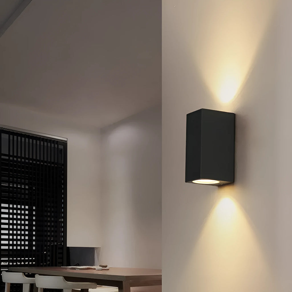 Modern black wall lamp with aluminium body, glass shade, and integrated LED light source.