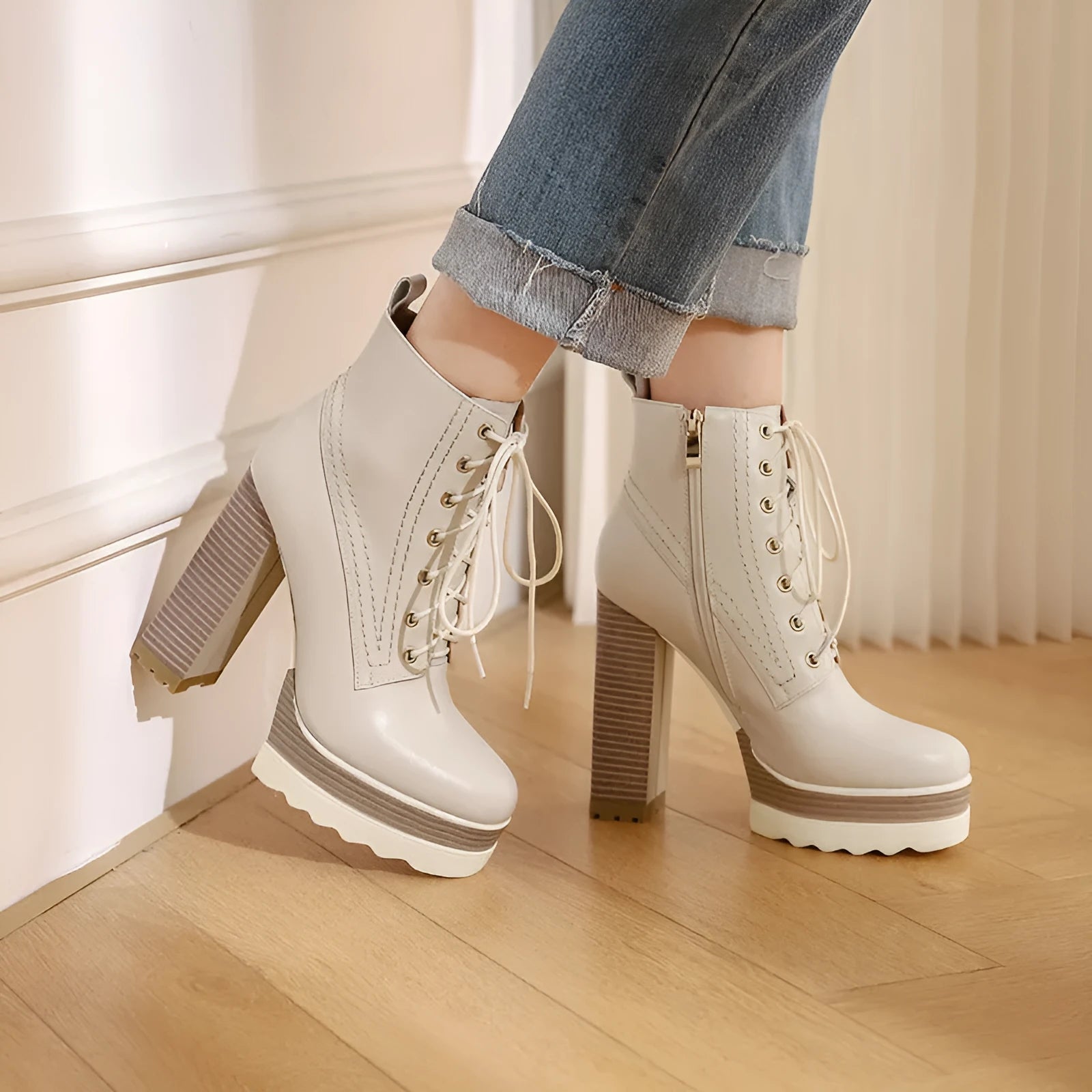Women's black waterproof platform ankle boots with chunky heel and side zip.