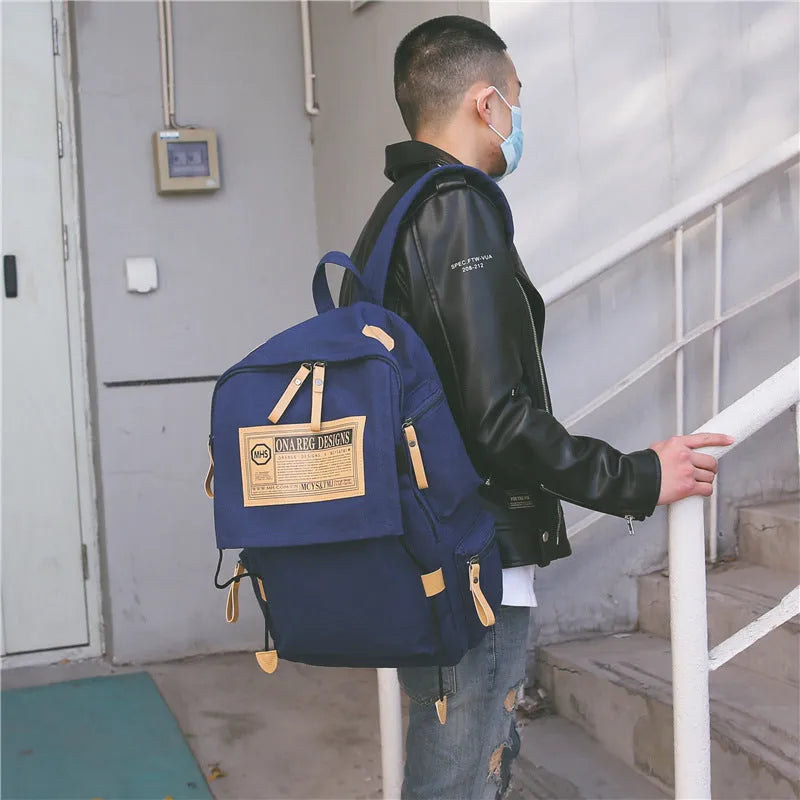 Korean canvas backpack large capacity travel computer bag with rain cover, zip closure, double straps, and multiple colours.