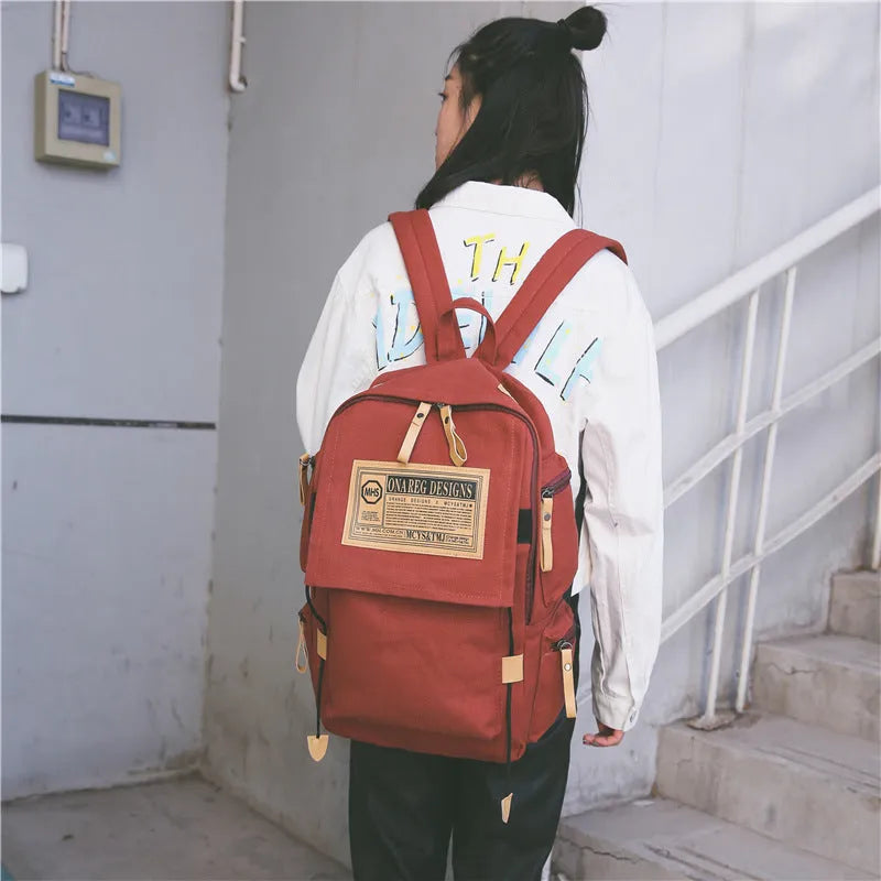 Korean canvas backpack large capacity travel computer bag with rain cover, zip closure, double straps, and multiple colours.