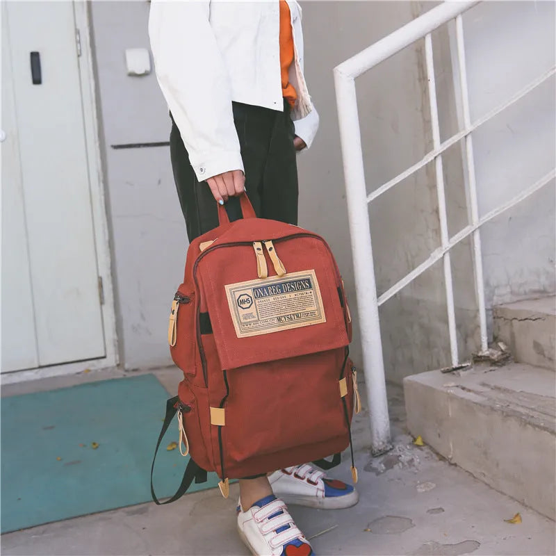Korean canvas backpack large capacity travel computer bag with rain cover, zip closure, double straps, and multiple colours.