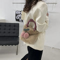 Large soft plush travel bucket bag in beige with open pocket and single shoulder strap