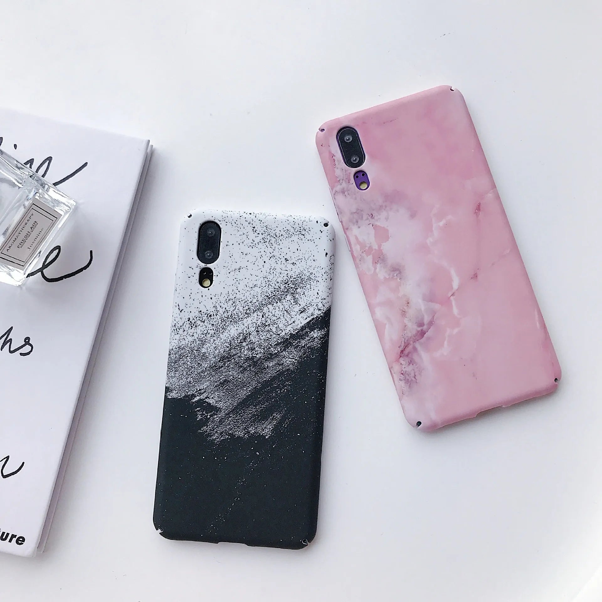 Painted solid colour phone case for Honor and Huawei smartphones in black or pink.