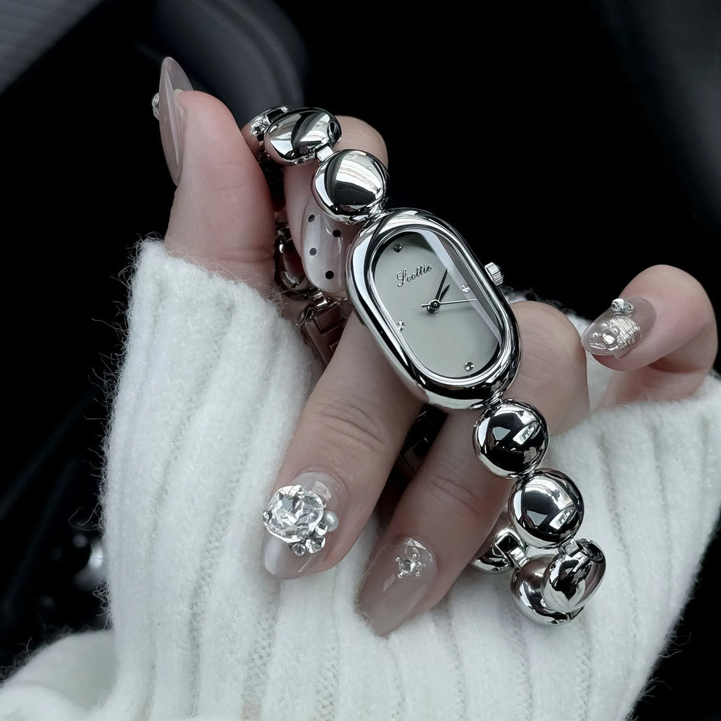 Women's oval dial watch with bracelet strap in multiple colour finishes including gold and platinum options