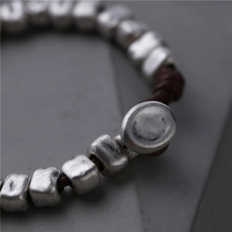 Women's handmade silver bracelet with wooden irregular square design on elasticated band