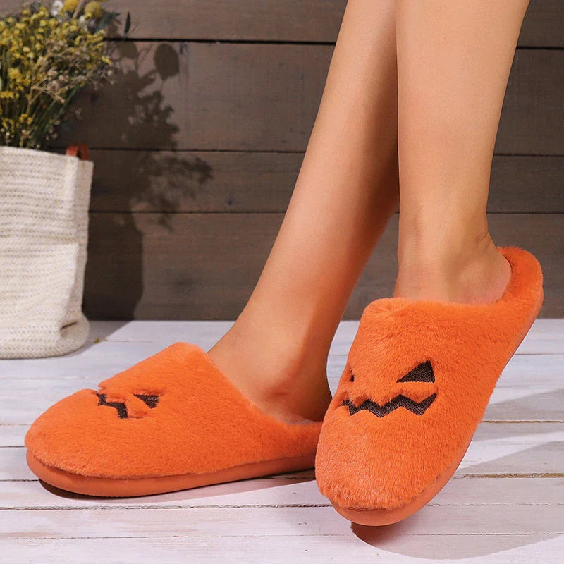 Cozy pumpkin-themed slippers with plush coral velvet upper and non-slip PVC sole for comfortable indoor wear