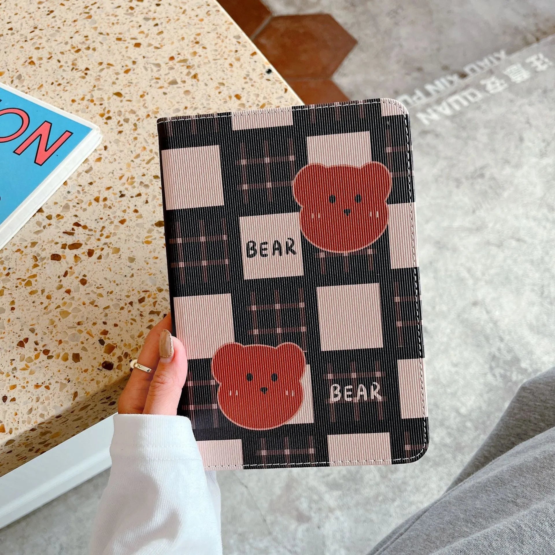 Cartoon protective flat case for iPad with black and brown plaid bear design, flip cover, silicone and TPU construction