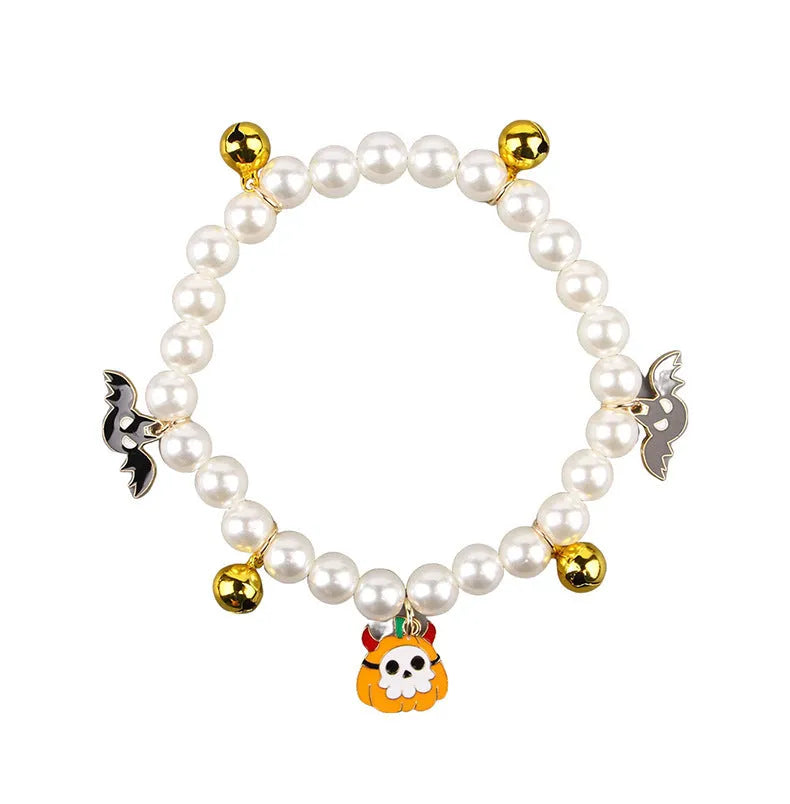 Halloween cat collar with simulated pearl necklace and pumpkin designs including purple ghost, skull, and smiling patterns