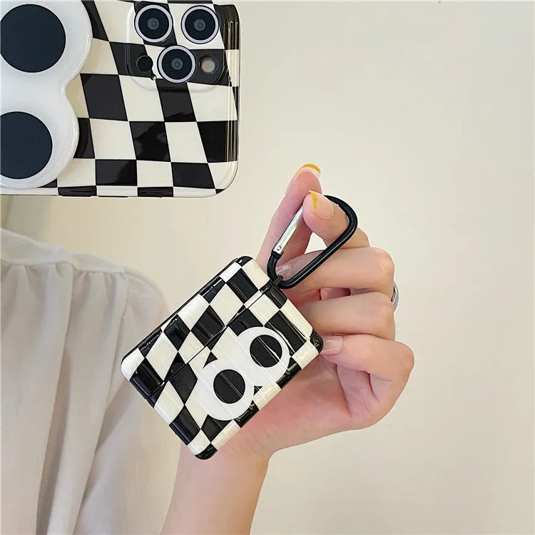 Checkerboard black and white grid TPU protective cover with large cartoon eyes for AirPods 1 2 3