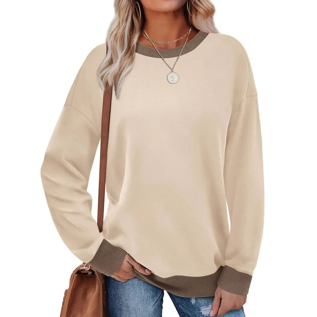 Loose fit striped long sleeve top for women in apricot colour, showing round neck and long sleeves.