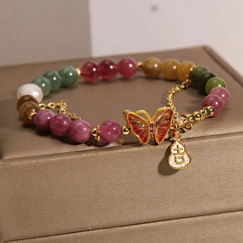 Natural jade coloured agate bracelet for women with butterfly and gourd shaped beads.