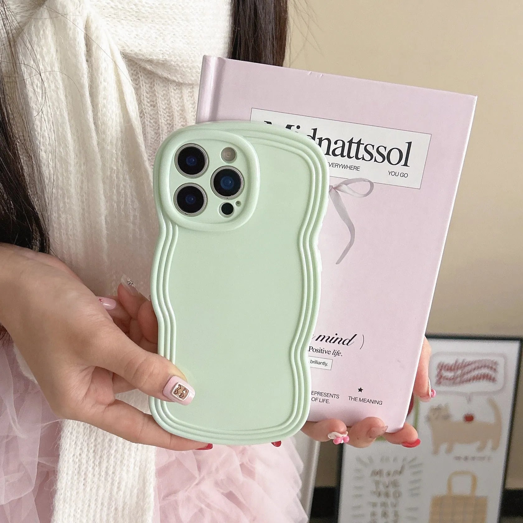 Wave pattern iPhone case in cream candy colour showing TPU material and anti-fingerprint surface