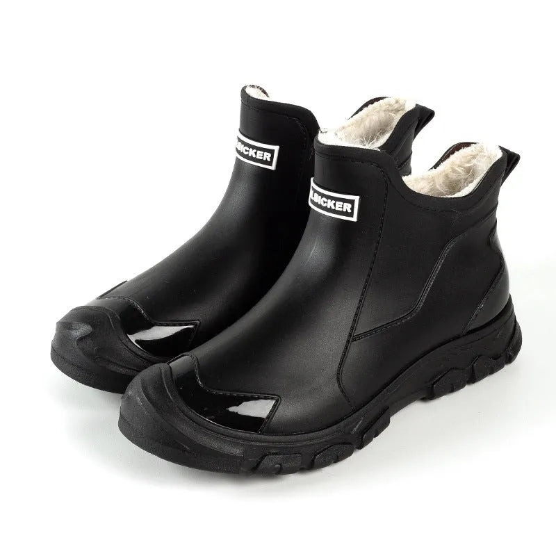 Pair of large size fixed velvet PVC rain boots in black, with round toe and flat heel, for outdoor use