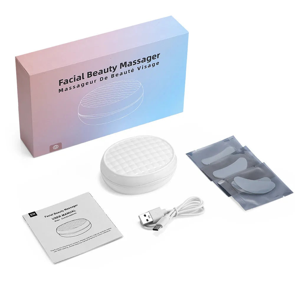 White wireless red light EMS eye and face massager device for dark circles and facial treatment