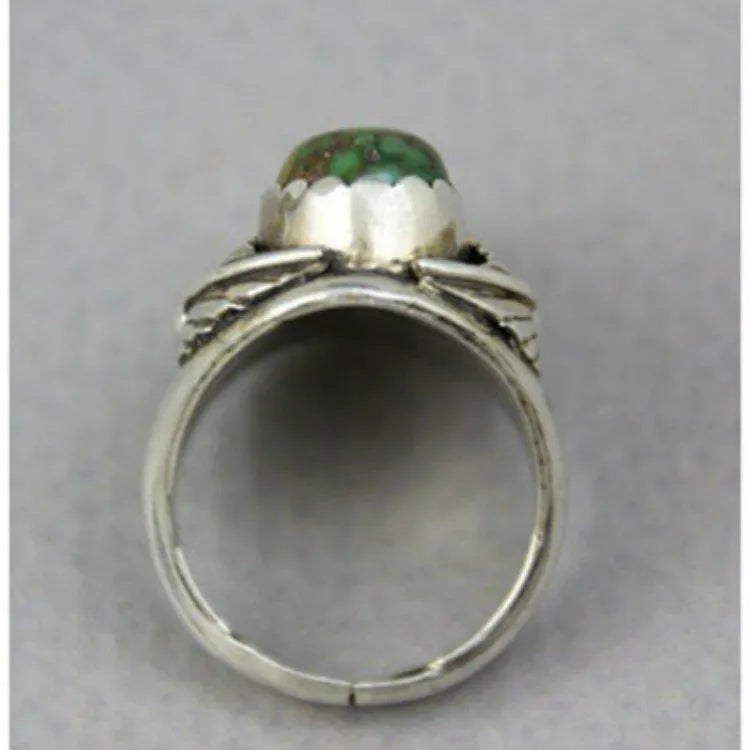 Turquoise geometric retro-style alloy ring for women on a ring stand.