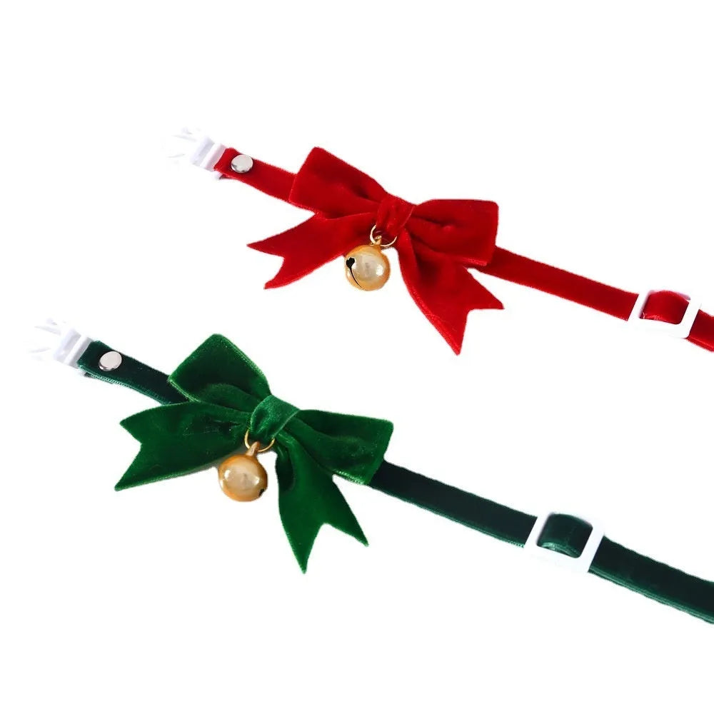 Pet velvet bow tie collar with anti-suffocation buckle in red velvet bow on small cat, S size