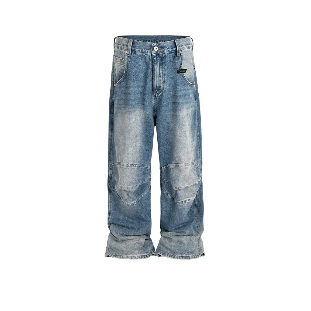 Baggy blue jeans with front pleats and a straight leg, shown in a washed denim finish.