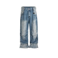 Baggy blue jeans with front pleats and a straight leg, shown in a washed denim finish.