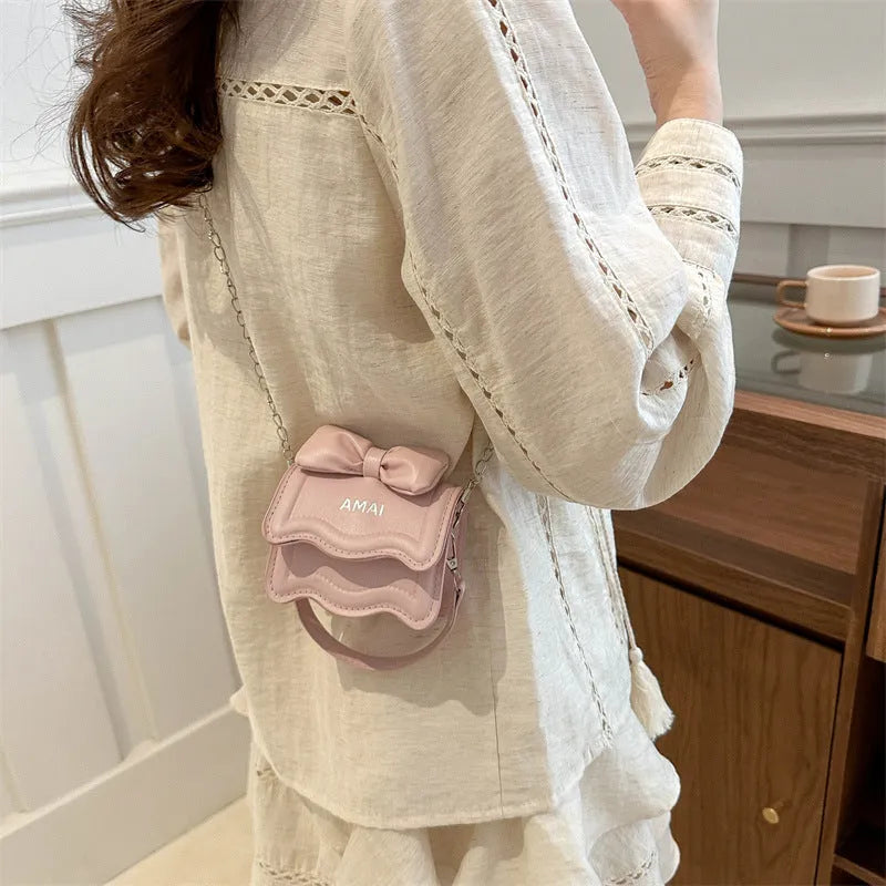 Small women's PU leather crossbody bag in seven colour options with single shoulder strap