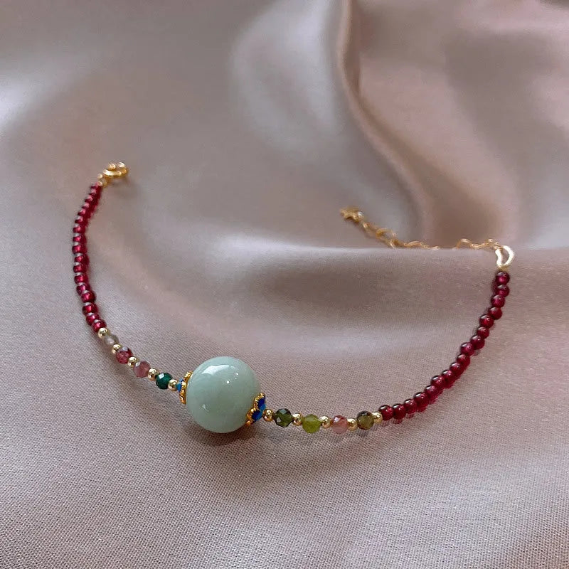 Women's garnet bracelet with aquamarine and tourmaline drop beads in Chinese Korean style design