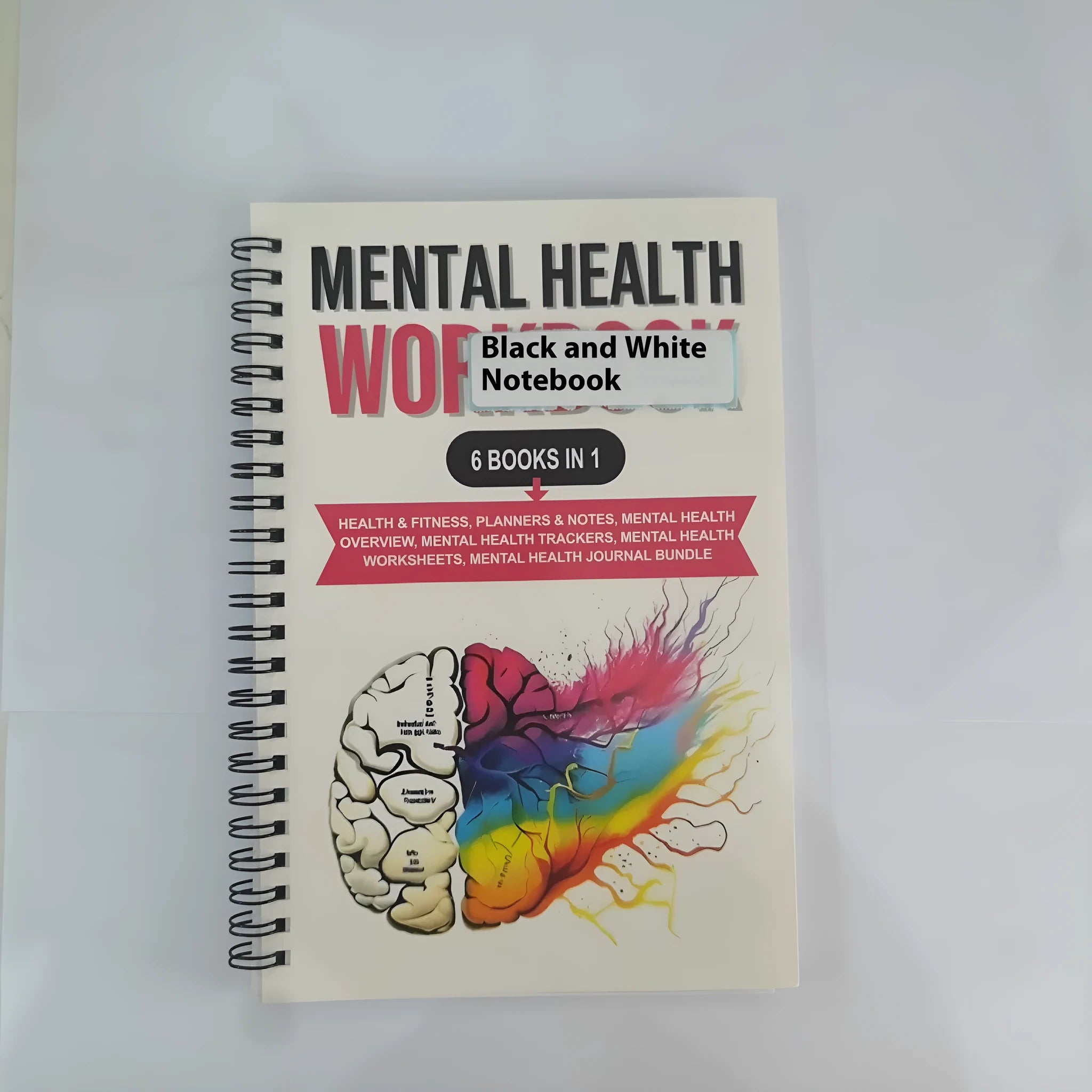 Pink paper cover coil-bound brain mental health notebook with 80g pages, open to blank pages